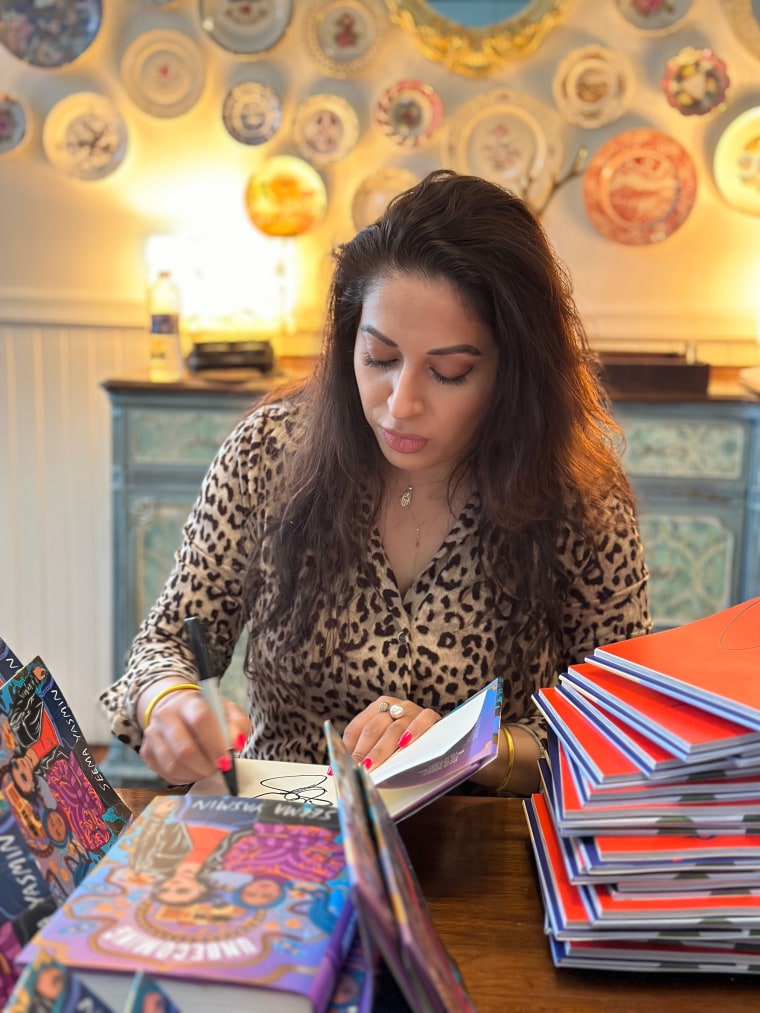 Dr. Seema Yasmin signing copies of her new book, “Unbecoming,” a young-adult novel published by Simon & Schuster.