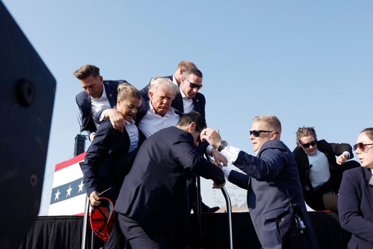 Donald Trump is rushed offstage during a rally on July 13, 2024 in Butler, Pa.