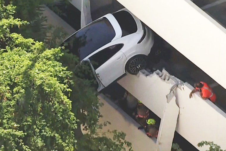 porsche suv accident parking garage