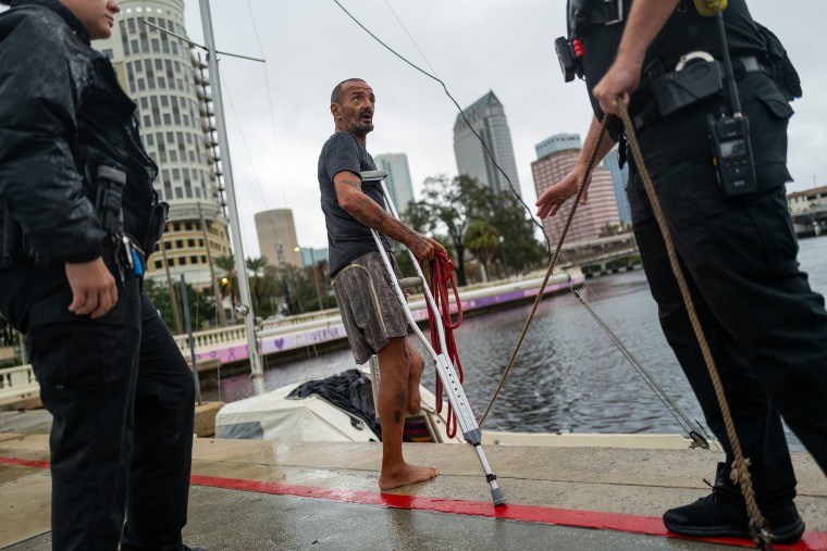 Tampa police try to persuade a man living on his boat known as "Lieutenant Dan" to leave for his safety