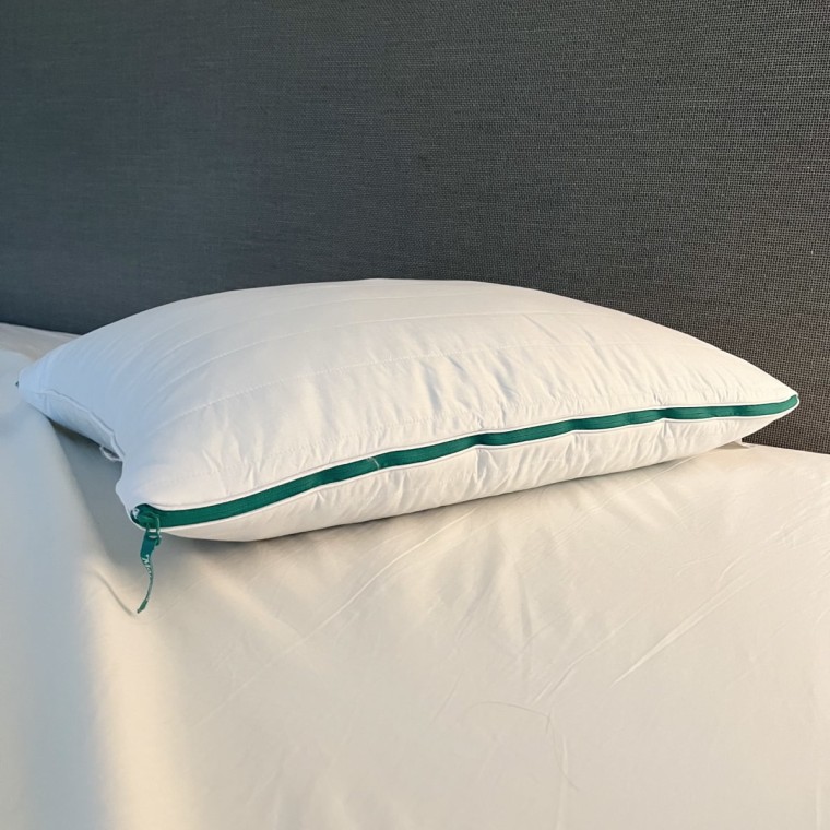 Marlow pillow on a bed with the zipper facing forward