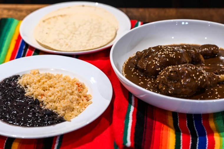 Mole chicken served with rice, beans and tortillas at the Ollín restaurant. The recipe is from Jonathan's grandmother and they import the spices from Mexico.