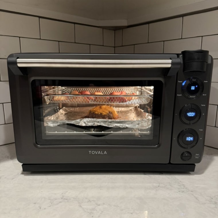 Tovala Oven with food inside of it in the corner of a kitchen