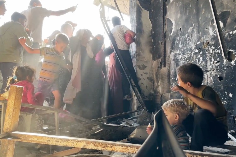 Two brothers waiting for bread in Gaza bring home the hunger and desperation sweeping the Palestinian enclave.