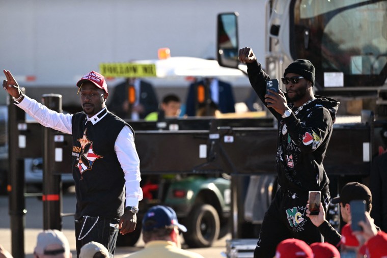 Antonio Brown and Le'Veon Bell wave to the crowd at a campaign rally for Donald Trump