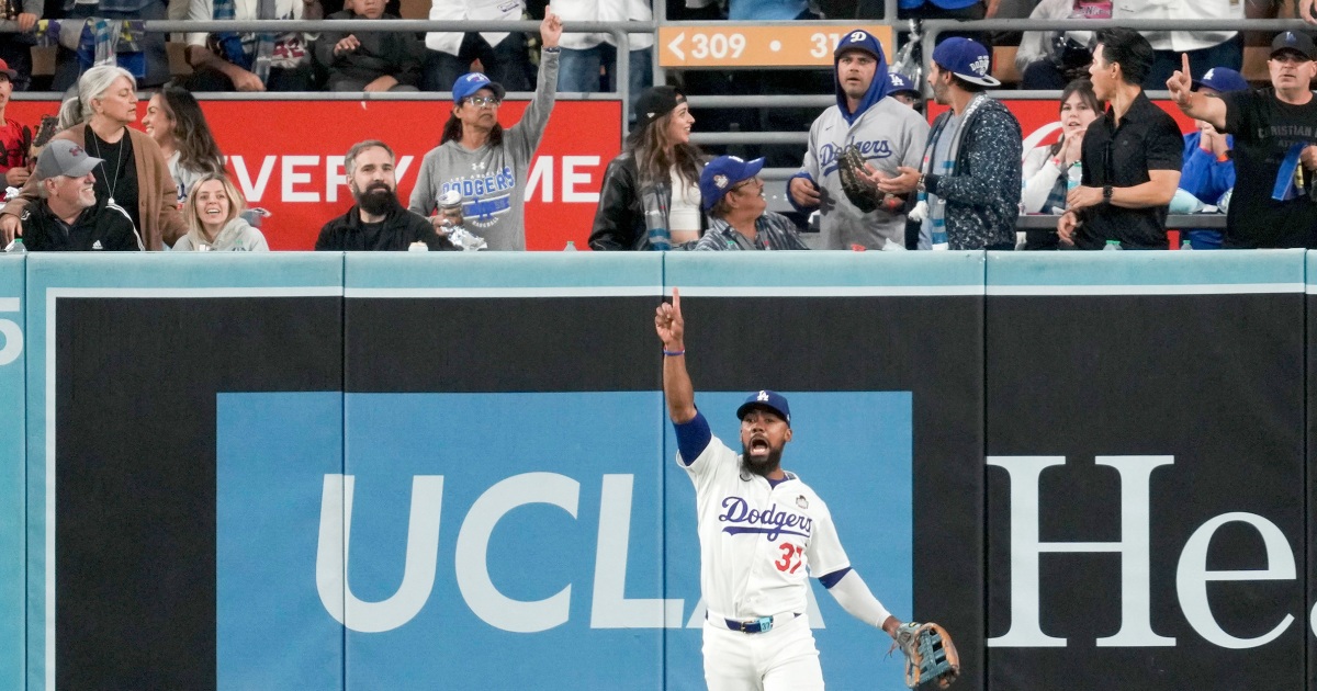 Gleyber Torres’ hit called a double after fan interfered and reached over stands to make the catch