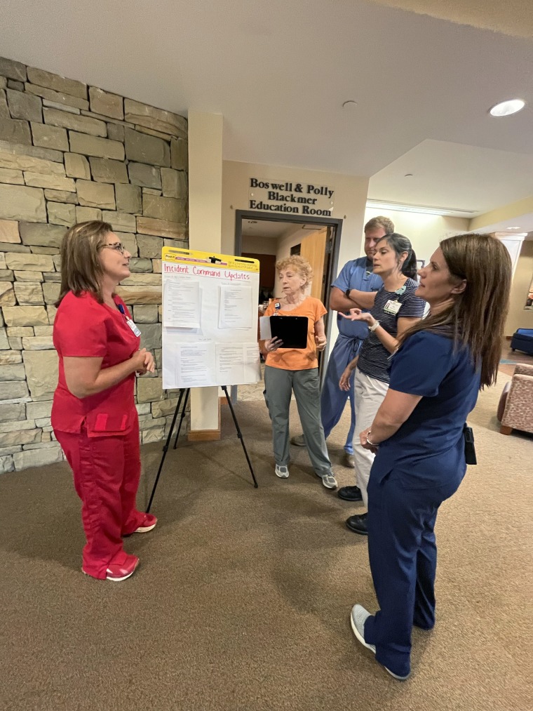 Dr. Lisa Kaufmann and staff meet to discuss the current situation at UNC Appalachian Regional Healthcare System.