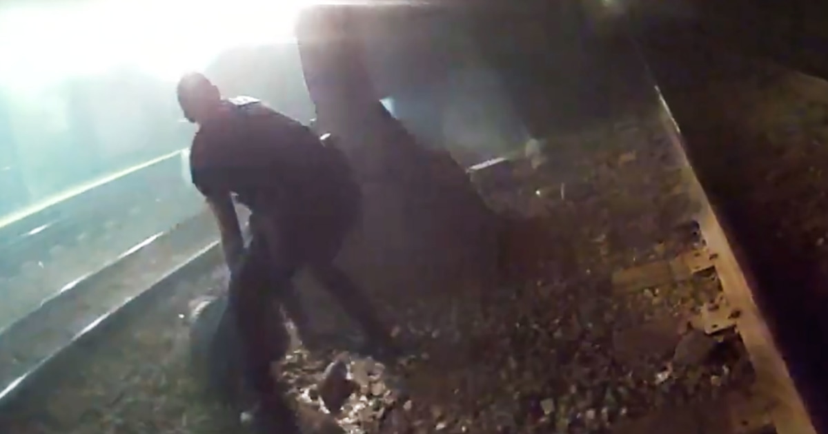 Police rescue injured man from tracks seconds before an oncoming train