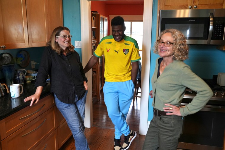 Cabrel Ngougou talks with his sponsors in the kitchen