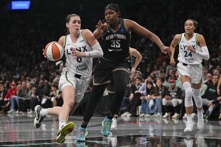 Minnesota Lynx forward Bridget Carleton drives against New York Liberty forward Jonquel Jones 