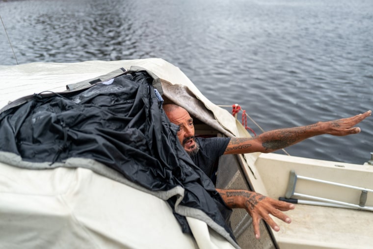 Tampa police try to persuade a man living on his boat known as "Lieutenant Dan" to leave for his safety